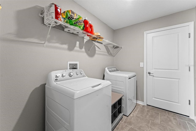 5354 Travertine St, Mount Dora, FL 32757 - laundry area featuring washer and dryer, laundry area, and baseboards