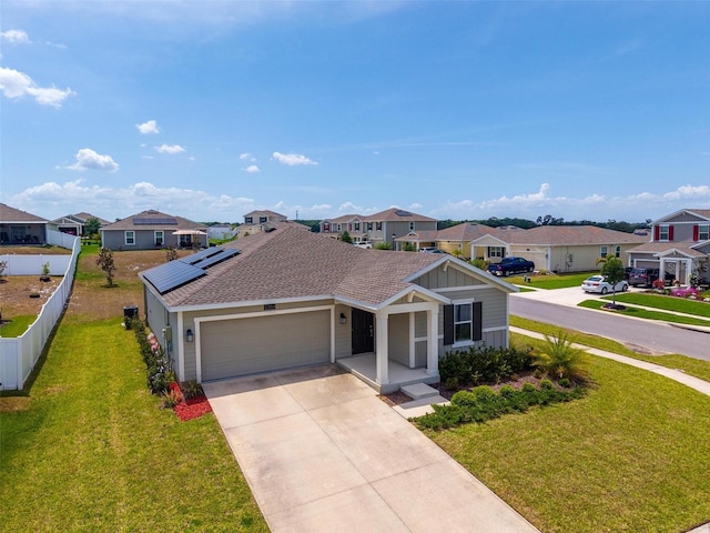 5354 Travertine St, Mount Dora, FL 32757 - view of front of property featuring driveway, a residential view, fence, a front lawn, and an attached garage