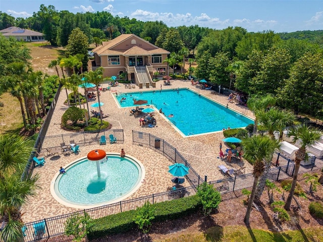 5354 Travertine St, Mount Dora, FL 32757 - community pool featuring fence, stairs, and a patio area