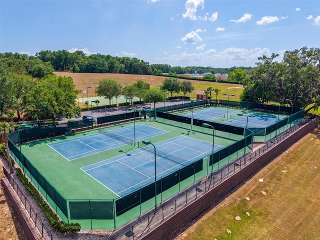 5354 Travertine St, Mount Dora, FL 32757 - view of tennis court featuring fence