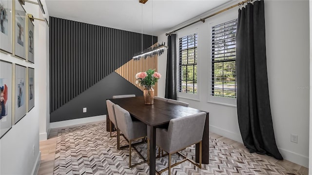 dining area featuring baseboards