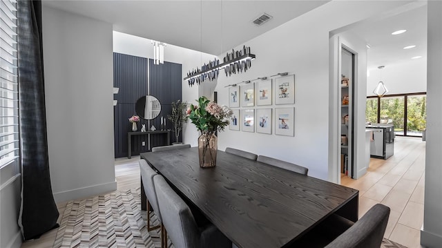dining area featuring baseboards, recessed lighting, and visible vents