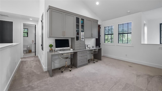 office area with light carpet, recessed lighting, baseboards, lofted ceiling, and visible vents