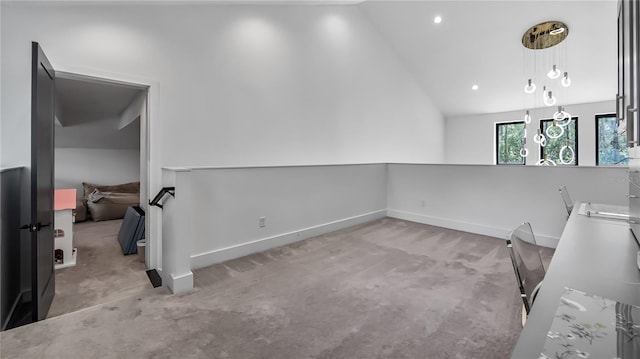 unfurnished room with baseboards, carpet flooring, vaulted ceiling, and recessed lighting