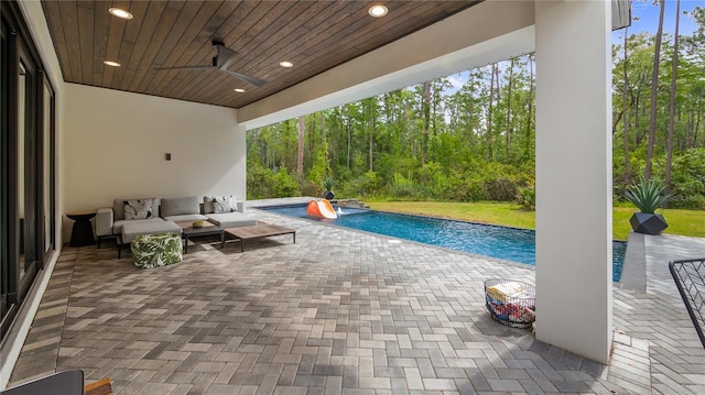 pool with an outdoor hangout area, ceiling fan, and a patio area