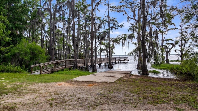 dock area featuring a water view