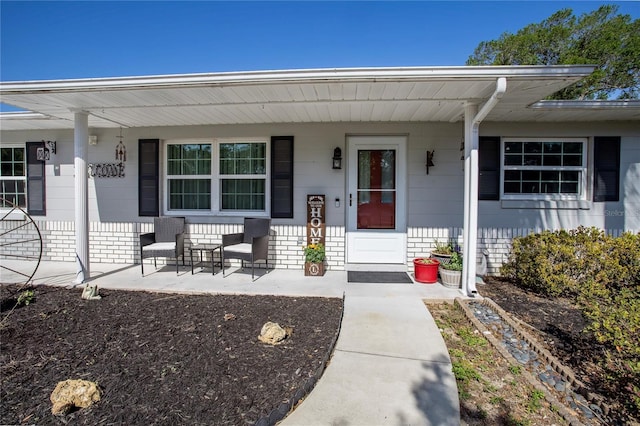 616 Third Ave, Lady Lake, FL 32159 - property entrance featuring covered porch and brick siding