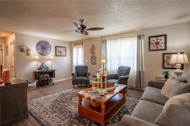 616 Third Ave, Lady Lake, FL 32159 - living area featuring baseboards, a textured ceiling, ceiling fan, and wood finished floors