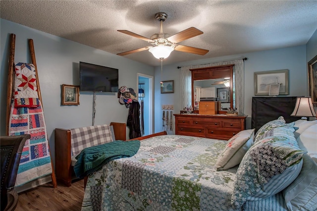 616 Third Ave, Lady Lake, FL 32159 - bedroom with a ceiling fan, a textured ceiling, and wood finished floors