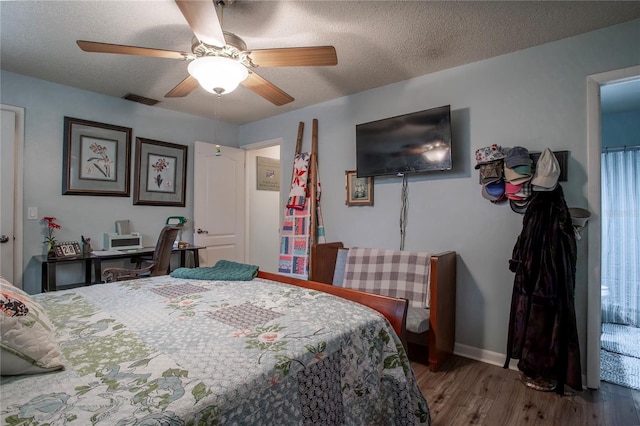 616 Third Ave, Lady Lake, FL 32159 - bedroom featuring ceiling fan, a textured ceiling, visible vents, wood finished floors, and baseboards