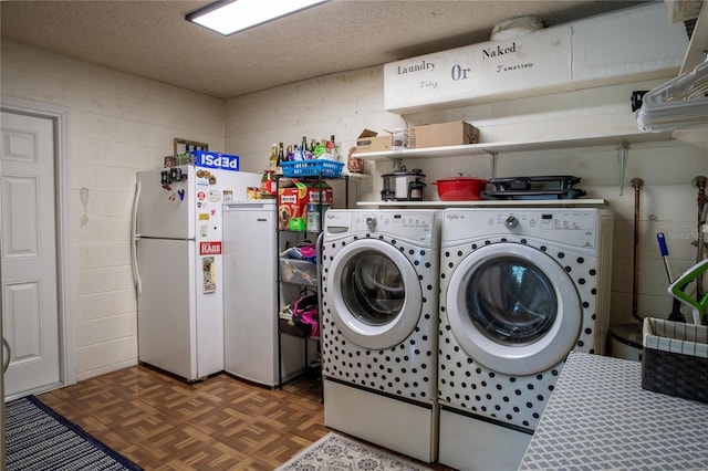 616 Third Ave, Lady Lake, FL 32159 - clothes washing area featuring concrete block wall, laundry area, washing machine and dryer, and a textured ceiling