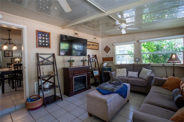 616 Third Ave, Lady Lake, FL 32159 - living room with ceiling fan, tile patterned floors, and a fireplace