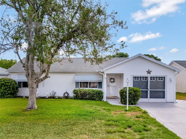 single story home featuring driveway, roof with shingles, a front lawn, and an attached garage
