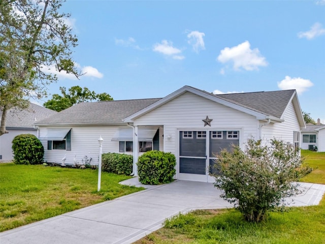 ranch-style home with an attached garage, concrete driveway, a shingled roof, and a front lawn