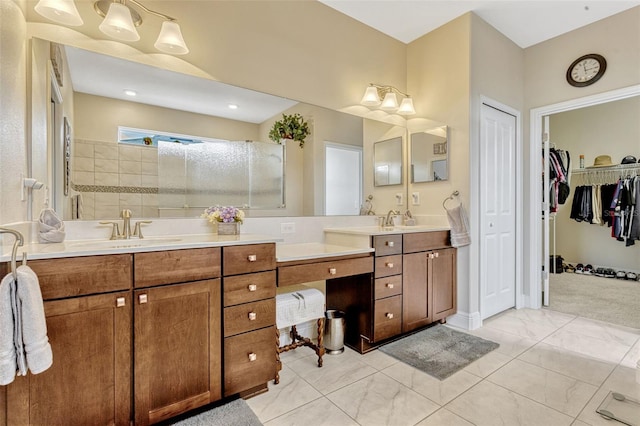 bathroom featuring walk in shower and vanity