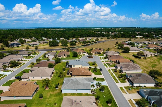 birds eye view of property with a residential view