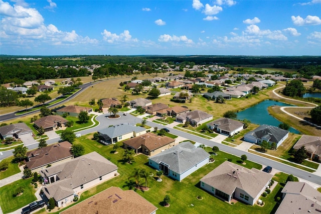 birds eye view of property with a residential view and a water view