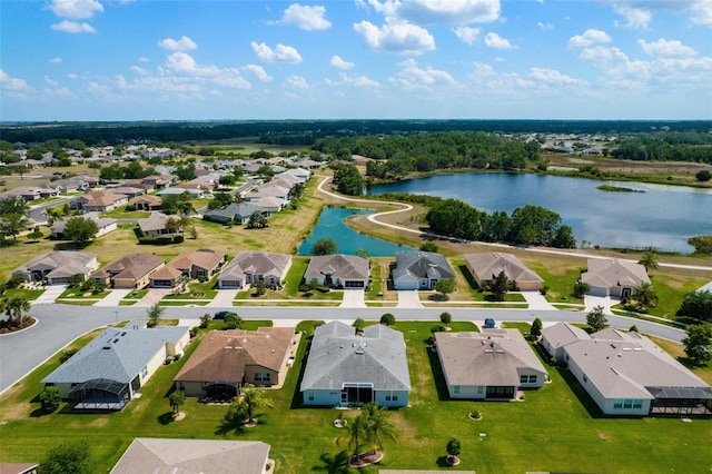 bird's eye view with a water view and a residential view
