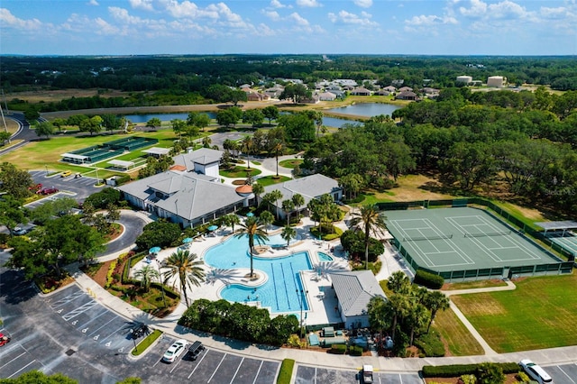 birds eye view of property with a water view