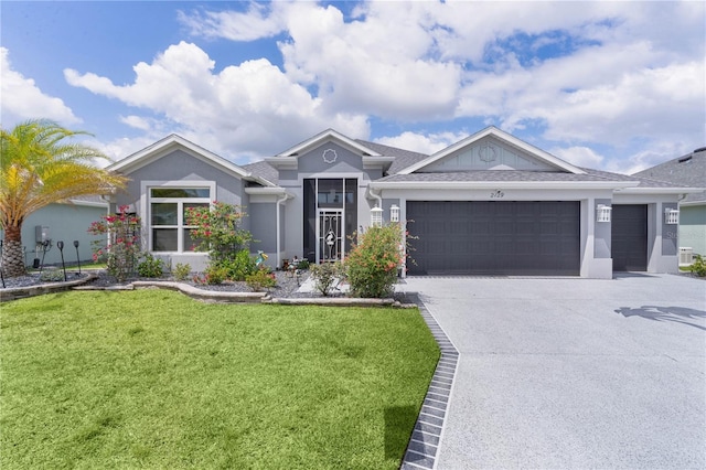 2129 Landrea Loop, The Villages, FL 32163 - ranch-style home with concrete driveway, stucco siding, a front yard, and a garage