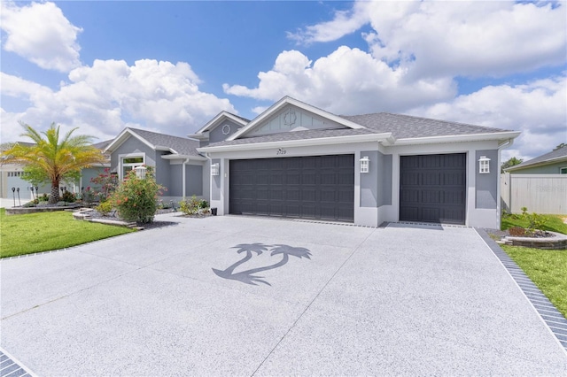 2129 Landrea Loop, The Villages, FL 32163 - ranch-style house featuring a front yard, a garage, fence, concrete driveway, and stucco siding