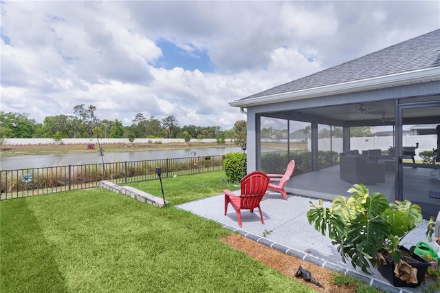 2129 Landrea Loop, The Villages, FL 32163 - view of yard featuring fence, a water view, a patio area, and ceiling fan