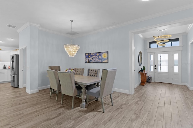 2129 Landrea Loop, The Villages, FL 32163 - dining room with visible vents, baseboards, a notable chandelier, and light wood-type flooring