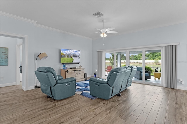 2129 Landrea Loop, The Villages, FL 32163 - living area with visible vents, ceiling fan, wood finished floors, and a healthy amount of sunlight