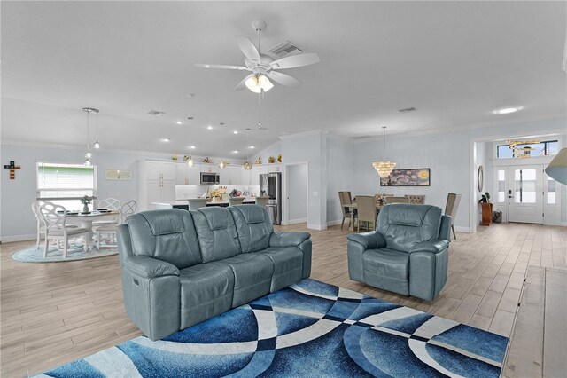 2129 Landrea Loop, The Villages, FL 32163 - living area featuring crown molding, baseboards, and light wood-type flooring