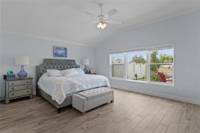 2129 Landrea Loop, The Villages, FL 32163 - bedroom featuring baseboards, ornamental molding, wood finished floors, and lofted ceiling