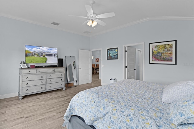 2129 Landrea Loop, The Villages, FL 32163 - bedroom featuring visible vents, a ceiling fan, light wood-type flooring, vaulted ceiling, and ornamental molding