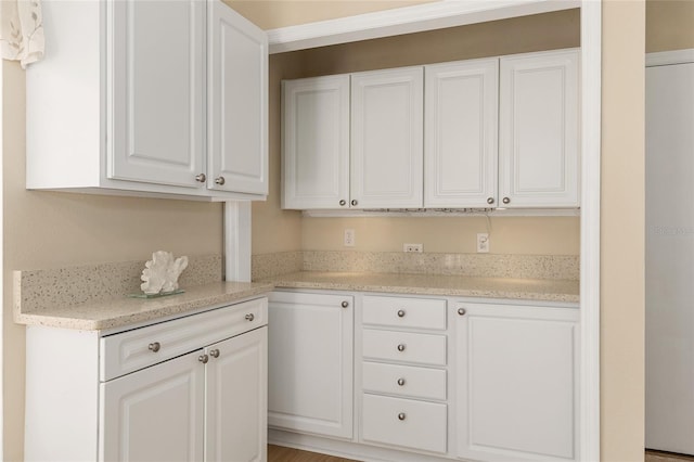 kitchen with white cabinets