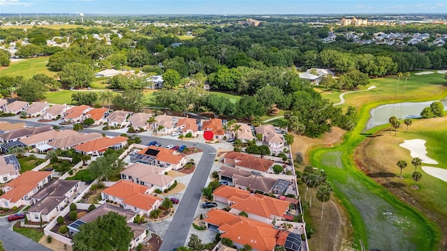 birds eye view of property featuring a residential view, view of golf course, and a water view