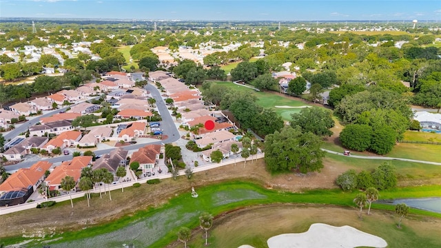 birds eye view of property featuring view of golf course and a residential view