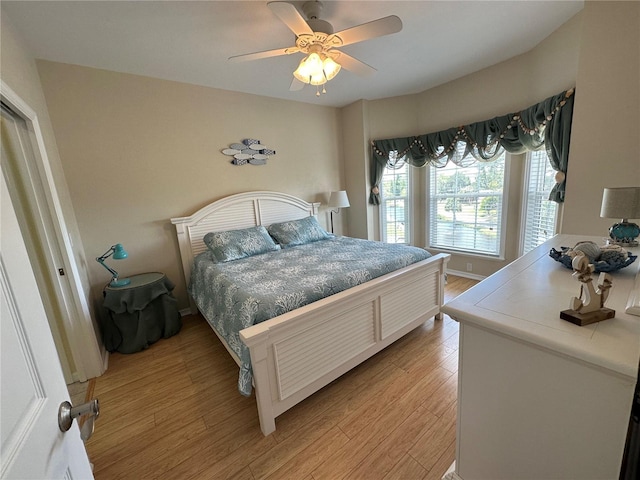 54 SE 910th Ave Unit 210/3, Suwannee, FL 32692 - bedroom featuring light wood-type flooring and ceiling fan