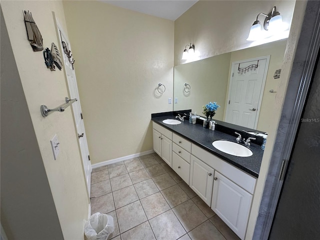 54 SE 910th Ave Unit 210/3, Suwannee, FL 32692 - full bath with double vanity, tile patterned floors, and baseboards