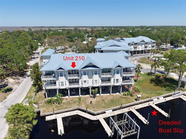 54 SE 910th Ave Unit 210/3, Suwannee, FL 32692 - aerial view of property and surrounding area with a nearby body of water and a tree filled landscape