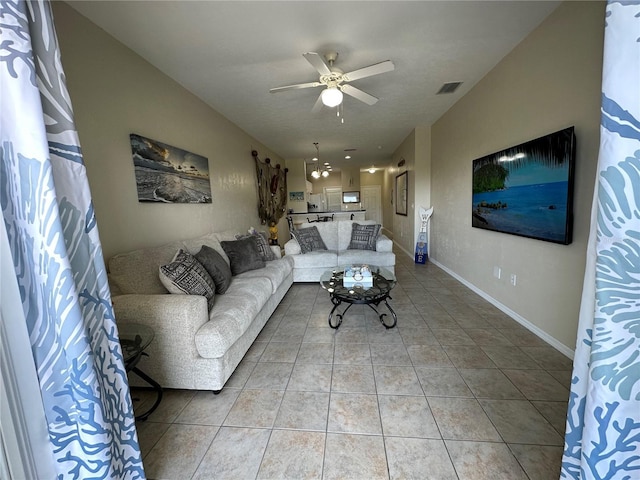 54 SE 910th Ave Unit 210/3, Suwannee, FL 32692 - living area featuring ceiling fan, light tile patterned floors, and baseboards