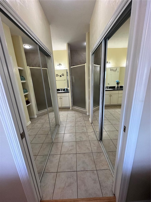 54 SE 910th Ave Unit 210/3, Suwannee, FL 32692 - full bathroom featuring a stall shower, vanity, and tile patterned flooring