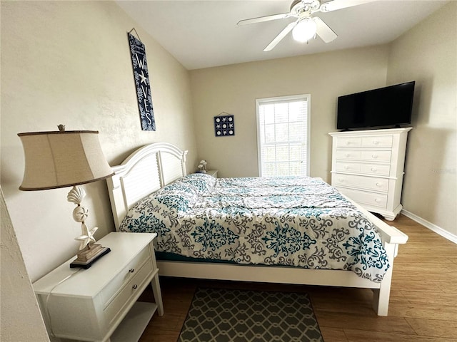 54 SE 910th Ave Unit 210/3, Suwannee, FL 32692 - bedroom featuring wood finished floors, baseboards, and a ceiling fan