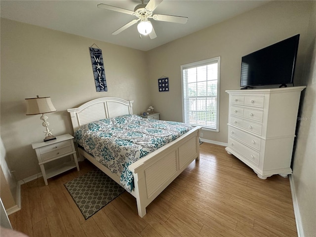 54 SE 910th Ave Unit 210/3, Suwannee, FL 32692 - bedroom with light wood-type flooring, baseboards, and ceiling fan