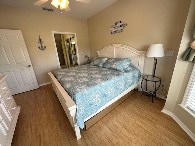 54 SE 910th Ave Unit 210/3, Suwannee, FL 32692 - bedroom with wood finished floors, baseboards, and ceiling fan