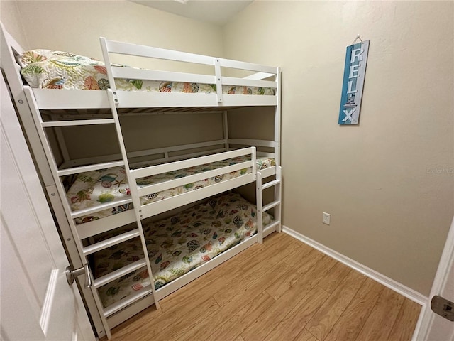 54 SE 910th Ave Unit 210/3, Suwannee, FL 32692 - unfurnished bedroom featuring wood finished floors and baseboards