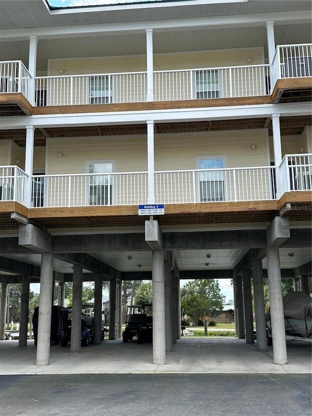 54 SE 910th Ave Unit 210/3, Suwannee, FL 32692 - view of building exterior featuring a carport
