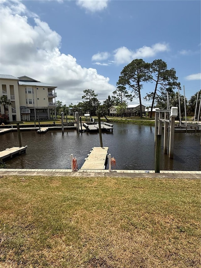 54 SE 910th Ave Unit 210/3, Suwannee, FL 32692 - dock area with a lawn and a water view