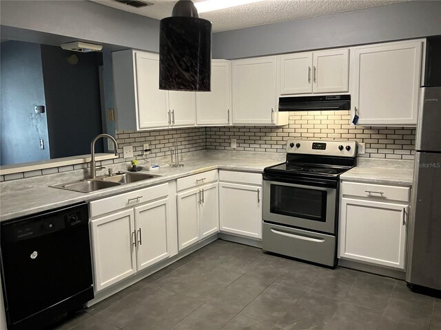 kitchen featuring ventilation hood, stainless steel appliances, decorative backsplash, and a sink