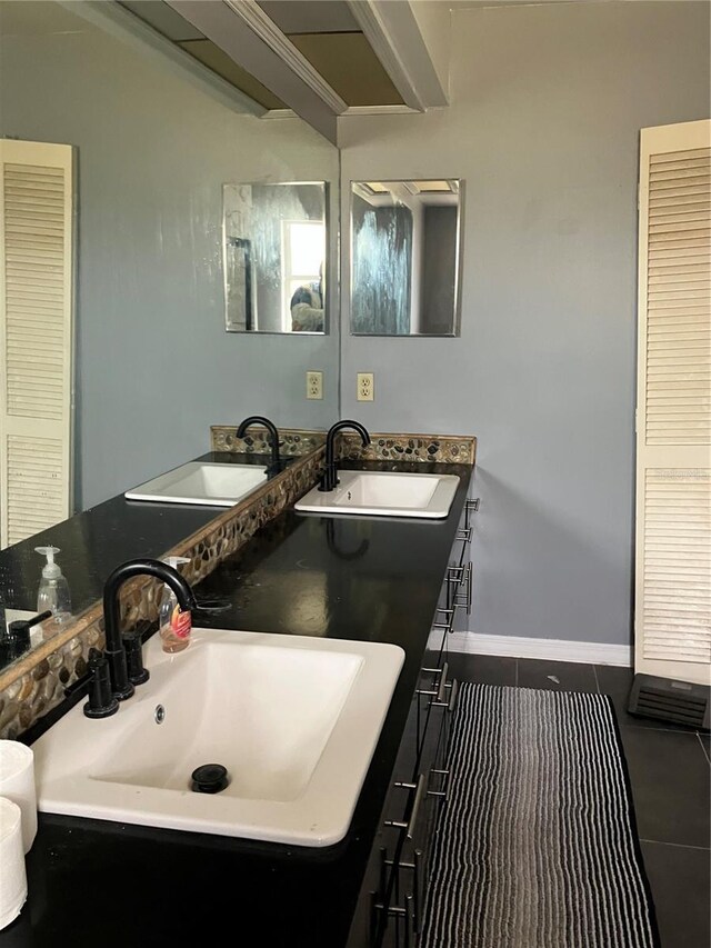 full bath featuring a sink, tile patterned flooring, and double vanity