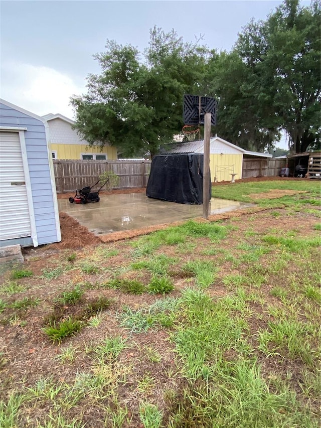 view of yard with fence and a patio area