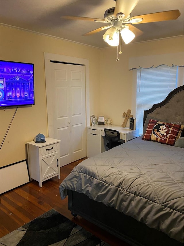 bedroom featuring a ceiling fan and dark wood-style floors