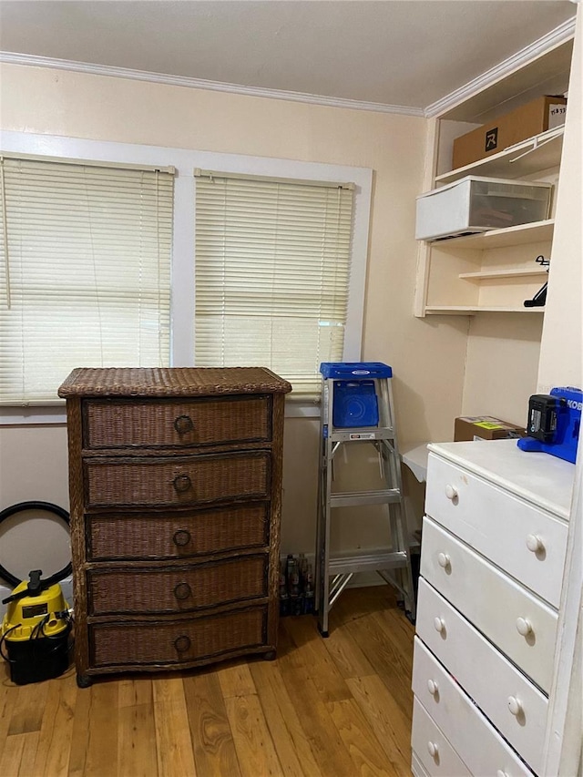 miscellaneous room with crown molding and wood finished floors